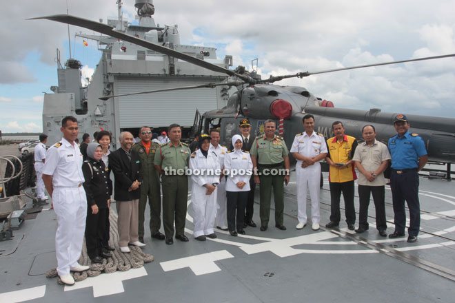 Jamalul (fourth right), Zaki (fifth right) and others on the ship. 