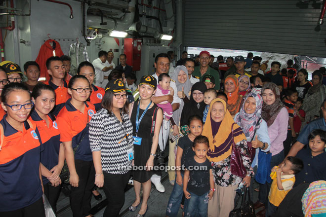 Jamalul (centre) with visitors and members of the media.  — Photos by Jeffery Mostapa 