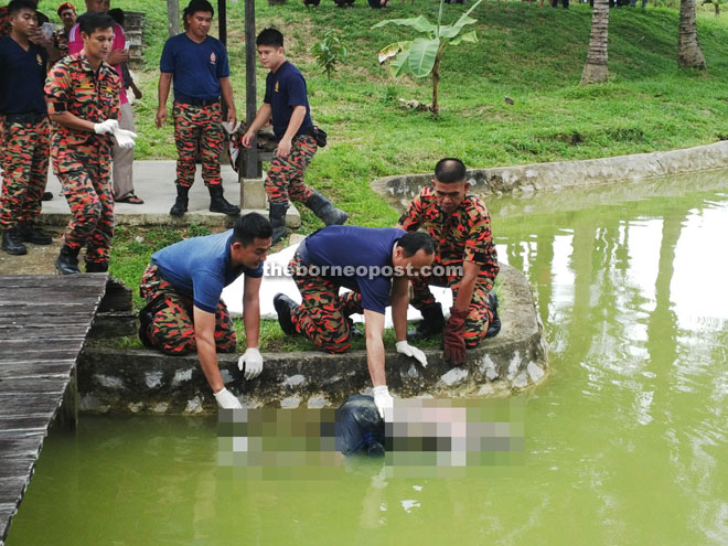 Firefighters retrieve the senior citizen’s body from the pond.