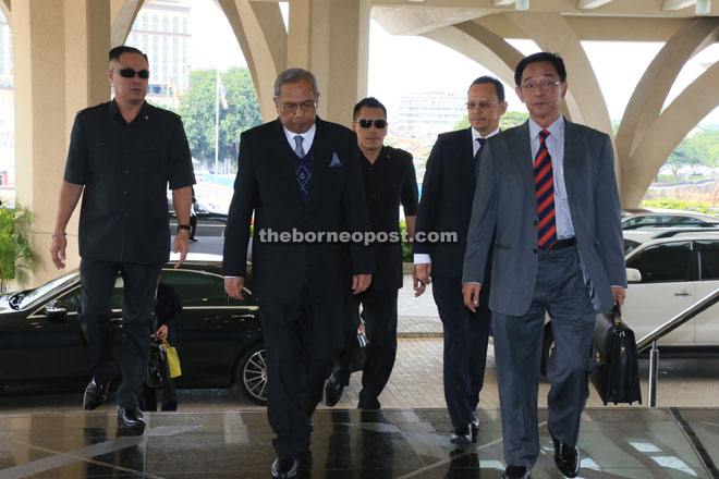 Adenan (second left) arriving at the State Legislative Assembly yesterday, accompanied by Housing Assistant Minister Datuk Abdul Karim Rahman Hamzah (right).