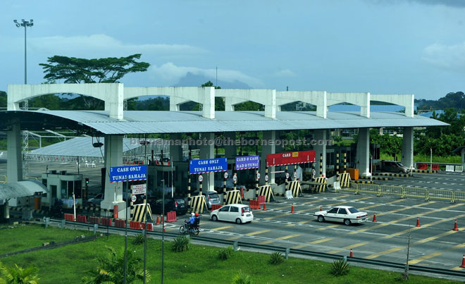 Vehicles queuing up at the Tun Salahuddin Bridge toll plaza in this file photo taken on Dec 27. — Bernama photo