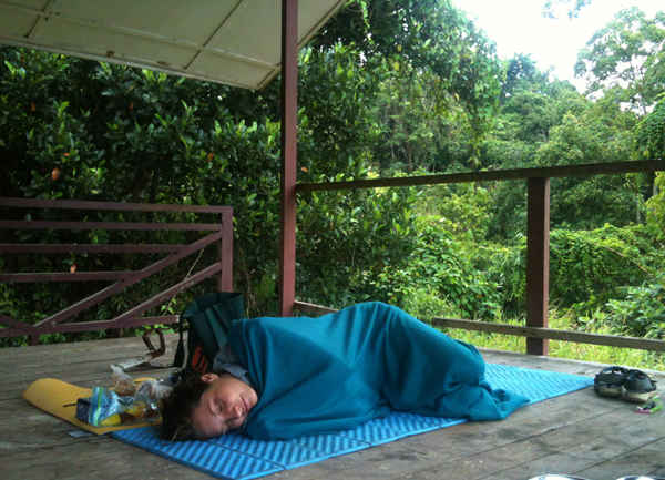 Iryna sleeps on the porch of an unoccupied house. 