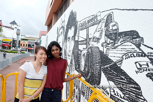 Siaw (left) and Janani have been working on the mural for the past two weeks.