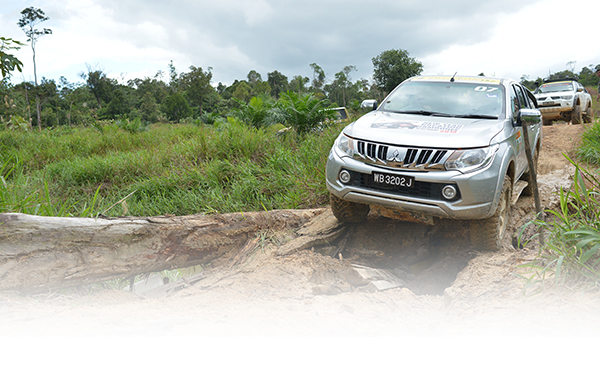 One of the all new Mitsubishi Tritons crosses a temporary bridge.