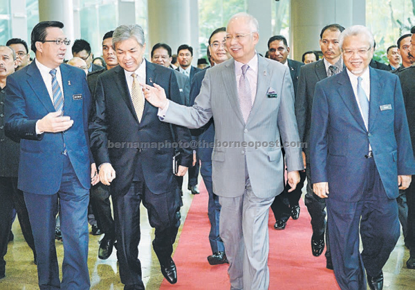 Najib (second right) and other cabinet minister walking out after the former tabled the budget recalibration at the Putrajaya International Convention Centre (PICC). — Bernama photo