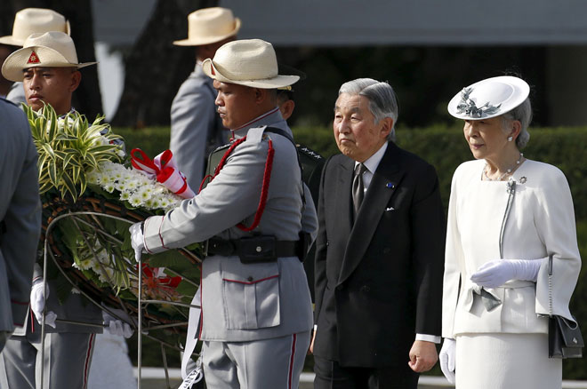Japan’s Emperor Akihito and Empress Michiko pay tribute at the graves of fallen Filipino heroes during a wreathlaying ceremony at the Libingan ng mga Bayani (National Heroes Cemetery) in Taguig, Metro Manila. — Reuters photo