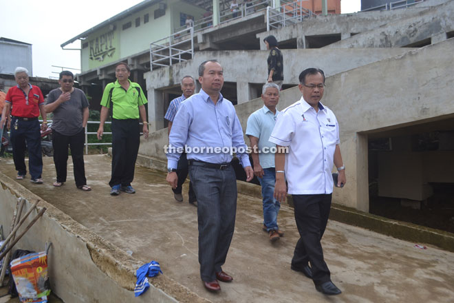 (Front from left) Elvis and Jamit lead the inspection of the clean-up. 