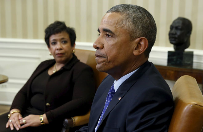 US Attorney General Loretta Lynch (left) looks toward Obama during a meeting with other top law enforcement officials to discuss what executive actions he can take to curb gun violence, in the Oval Office of the White House in Washington. — Reuters photo