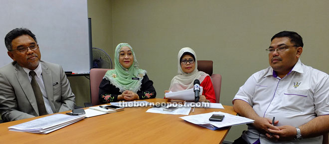 Serina (second left) and Fatimah speaking to reporters.