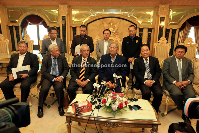 Adenan speaking at the press conference. With him are (seated from left) Morshidi, Manyin, Jabu, Wong, Mawan, Dr Rundi (standing second right) and Abdullah (standing right). — Photo by Kong Jun Liung