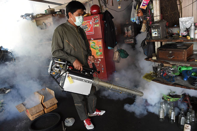 A municipal worker fumigates a residential area against the Aedes aegypti mosquito as a preventive measure against the spread of the dengue fever in Bangkok. Health experts have also warned Asia is particularly vulnerable to the Zika virus, given that the Aedes aegypti mosquito — which carries Zika, dengue fever and the chikungunya virus — thrives in its congested cities. — AFP photo