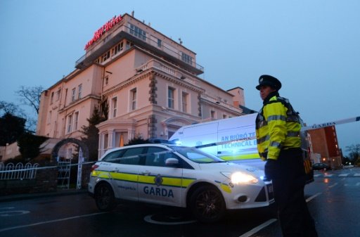 AFP/File | An Irish police officer at the cordon sealing off the Regency Airport Hotel in Dublin on February 5, 2016 following a shooting 