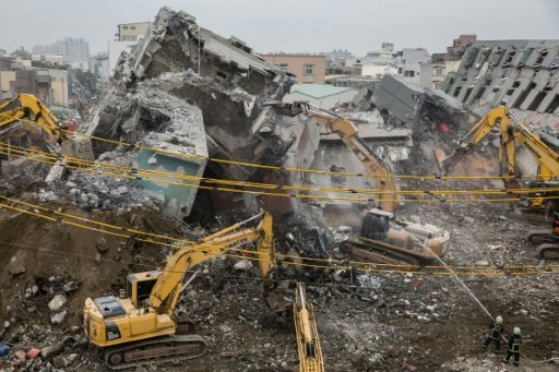 Excavators are usedon February 10, 2016 during the search and rescue operation at the Wei-Kuan complex, which collapsed in the 6.4-magnitude earthquake in the southern Taiwanese city of Tainan. -AFP Photo