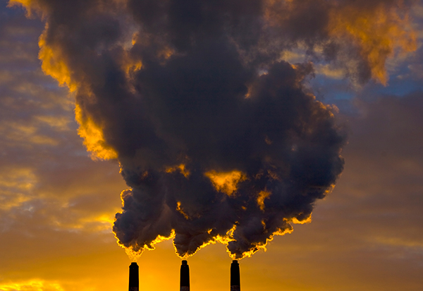 Chimney stacks release polluting gases.