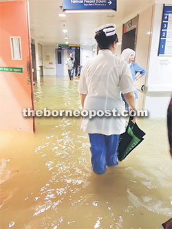 SGH staff wade through a corridor. 