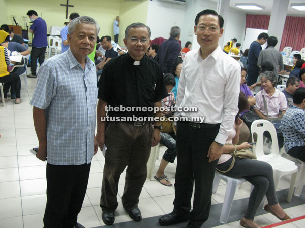 From left - Hilary Giang, St Faith’s Church priest-in-charge Nelson Ugas and Rev Joshua Jo at the free medical services at St Faith’s Church.  