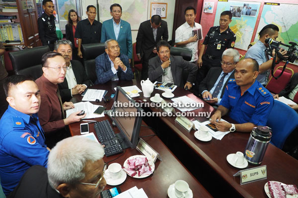 Adenan (seated centre) chairing the press conference at the State Operations Room at Wisma Bapa Malaysia in Petra Jaya yesterday.