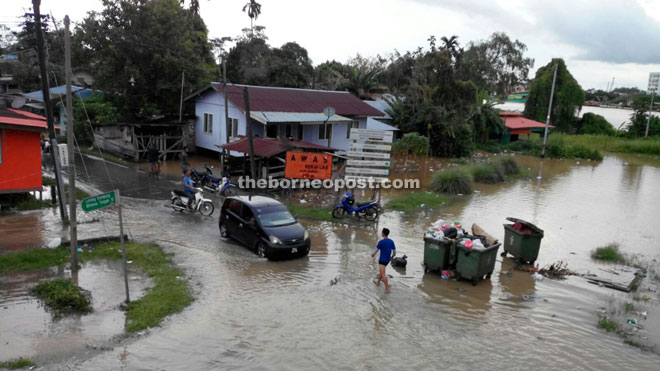 A flood scene at one of the villages in Kuching.