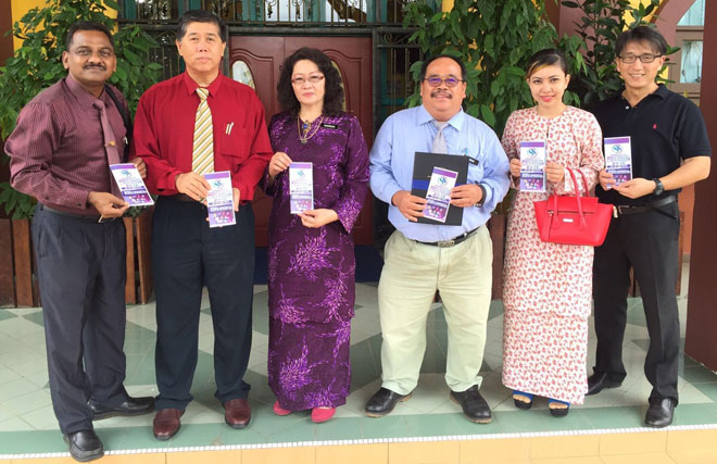 (From left) Dana, Dr Ong, Hamsiah, Faben, Cyndra and Dr Chin showing a pamphlet of the conference.