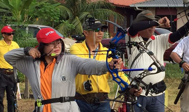 Competitions Aiming for the bull’s eye are some of the participants getting ready for the archery competition.