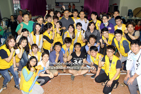 Rev Joshua Jo (fifth right, third row), Dr Kang (seventh right) and the medical team in a photo call at the St Francis’ Church. 