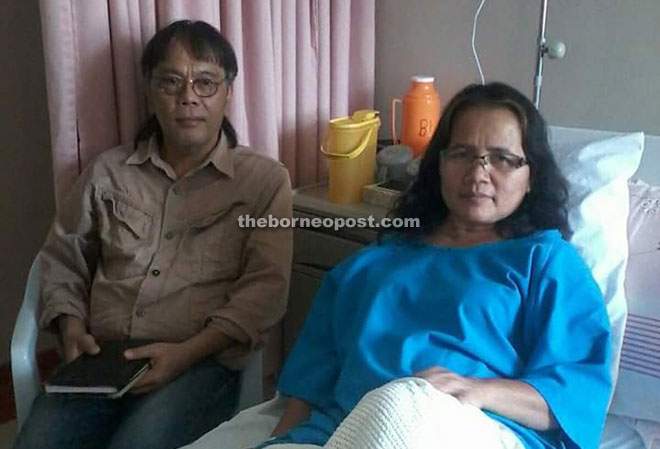 Elli is seen with Idah, who is undergoing treatment in Kuching.