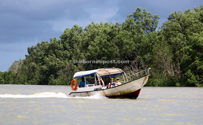 Foreign tourists enjoy a boat ride that take them around KWNP.