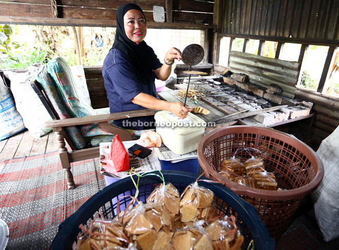 Wina makes Kuih Sepit at her house in Kampung Sungai Aur.