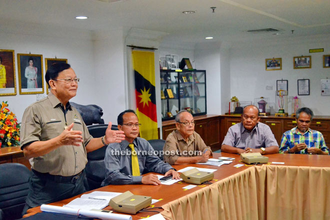 Wilfred (left) conducting the briefing. Seated from second left are John, Temenggong Wilfred, Penghulu Manang, and a participant.