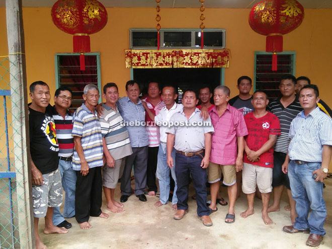 Rolland (fifth left) during a CNY visit to one of the houses in Nanga Nyelong, Julau. 