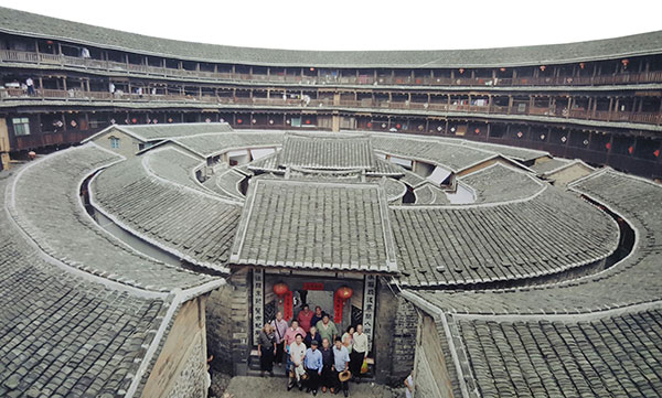 The Hakka delegates at the main entrance of a tulou.