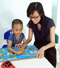 Vong guides a child to speak properly.