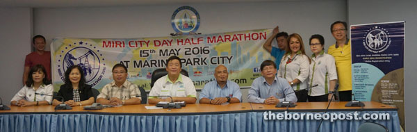 Lai (seated third left) with the organising committee of Miri City Day Half Marathon 2016.