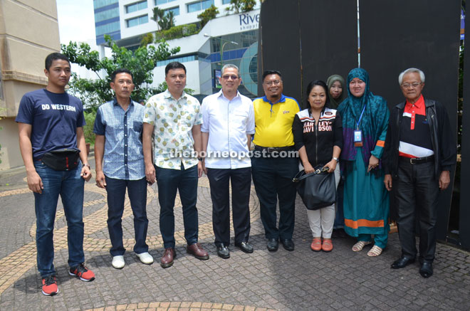 Abang Ahmad Urai (right) and other guests including Azizi Fauzi (left), Mohamad Irtidzar (third left), Lily Marcella (fourth right), Abang Mohammad (fifth right), and Supt Ismail Mahmood (second left) before the start of the ride. 