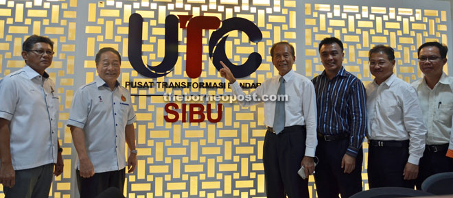 (From left) Bakrie, Wong, Tiong, Morshidi and Ng pose in front of UTC Sibu logo.
