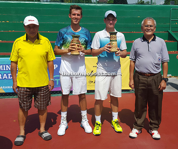 Canter (second, left) and Sokolovsky with SLTA officials Douglas (right) and Bong after  the boy’s doubles title yesterday.