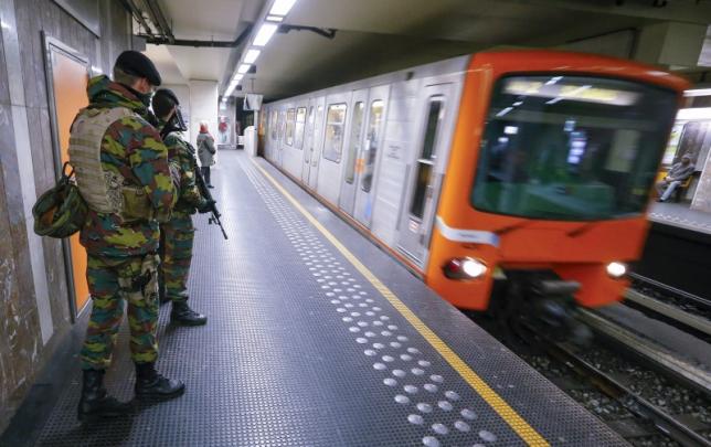Belgian soldiers patrol in a subway station in Brussels, Belgium, in this November 25, 2015 file photo. REUTERS/Yves Herman/Files