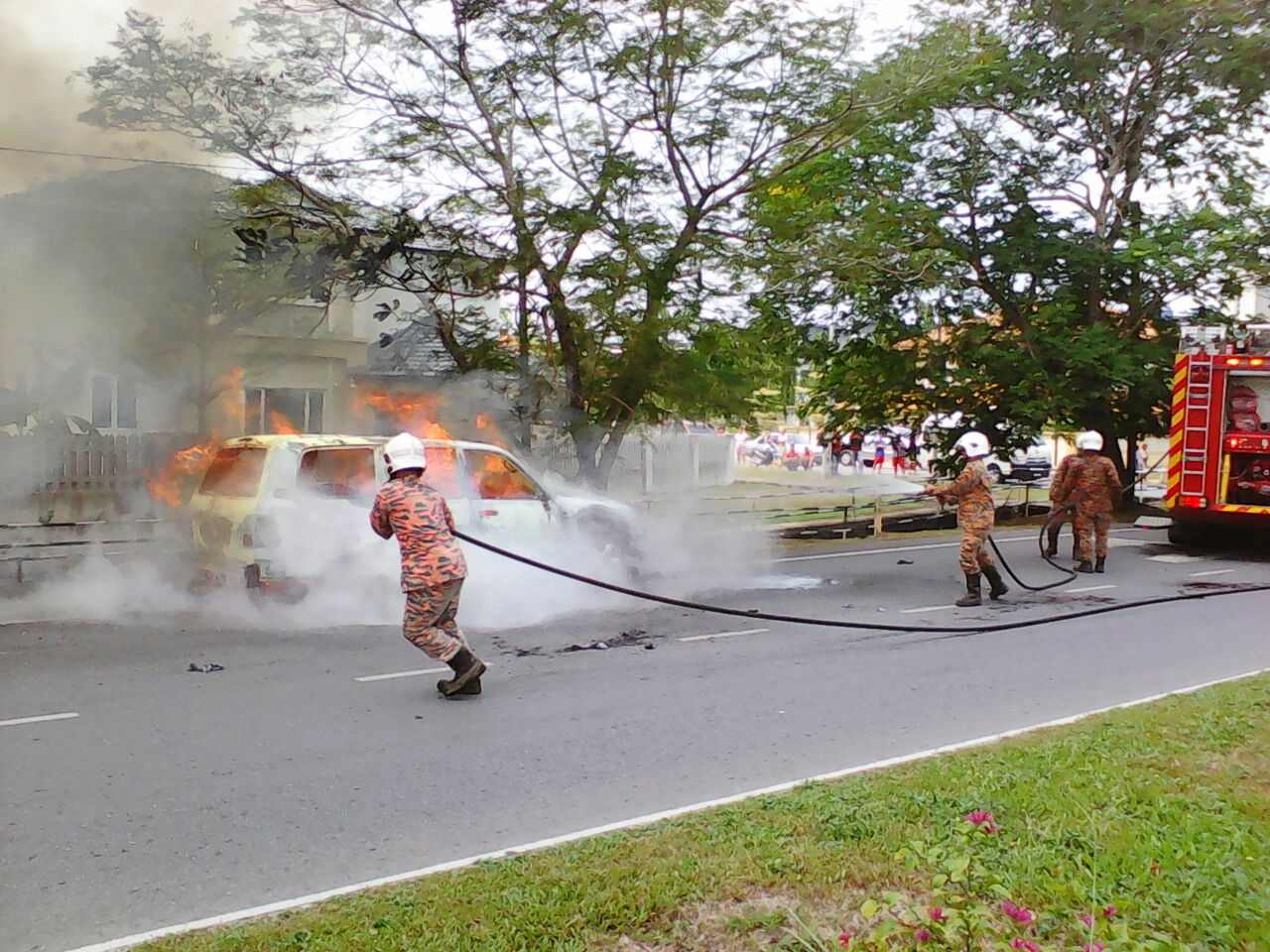Firefighters work to put out the fire.