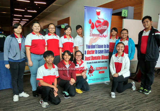 Members of SMK Kuching Town No. 1 Red Crescent Youth Unit during the blood donation campaign at the education fair.   