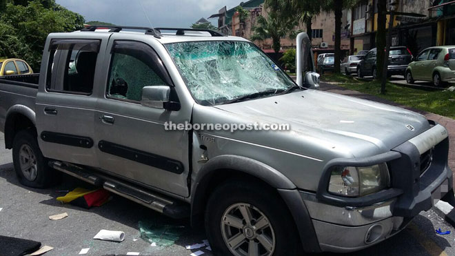 The damaged pickup truck near Ban Hock Road yesterday, following a minor collision which degenerated into a heated argument and assault.