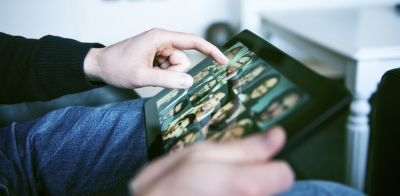 A touchscreen tablet can be just as effective as a traditional magnification device for the visually impaired. ©mikkelwilliam/Istock.com