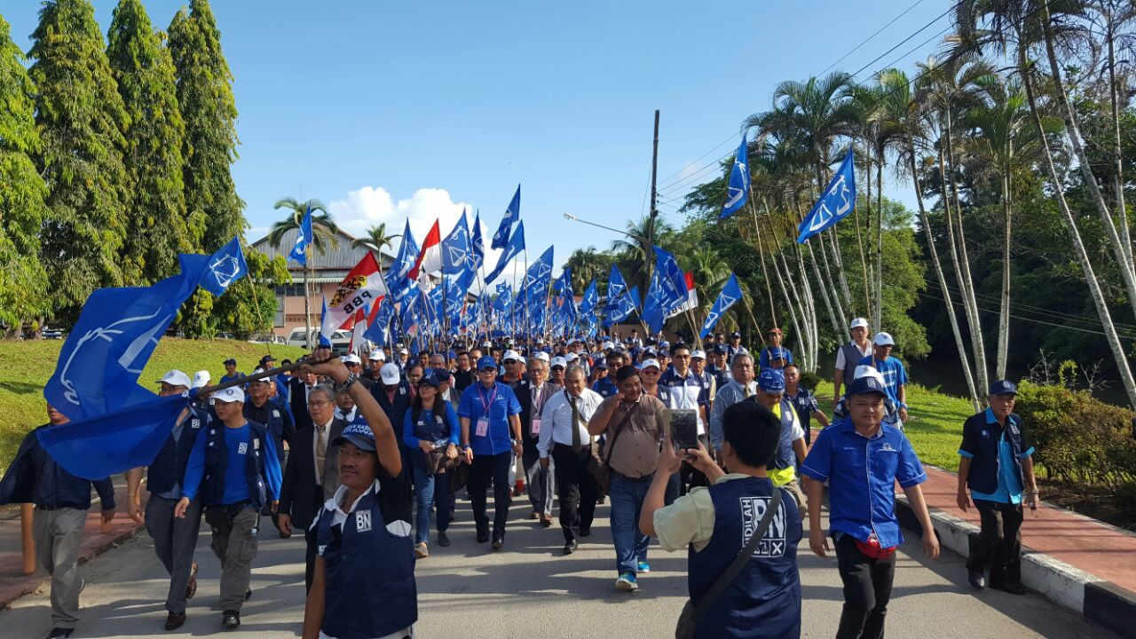Engkilili incumbent Dr Johnical Rayong Ngipa marching with his supporters from his office to the nomination centre in Engkilili town.