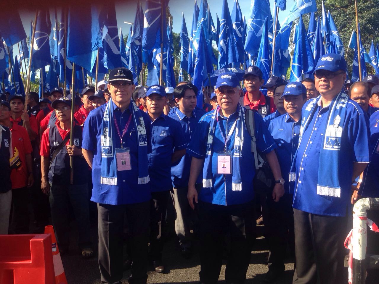 BN Tebedu candidate Dato Sri Michael Manyin (middle), flanked by Rural and Regional Development Minister Datuk Seri Ismail Sabri Yaakob (right) and Human Resources Minister Datuk Seri Richard Riot together with BN supporters wait for nomination process to begin at Tebedu District Office.