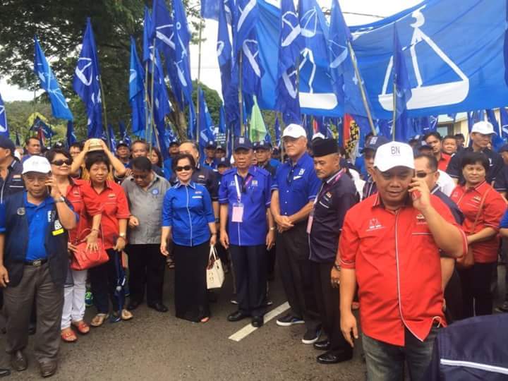 BN candidate for Katibas Datuk Ambrose Blikau Enturan (fourth right) with his supporters marching to nomination centre at Song District Office in Song.