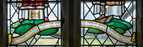 Close up shows the inscription on the stained glass window.