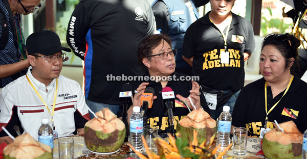 Abang Johari (centre) speaks at the press conference during the hi-tea. Also seen are Kuching Iron Tigers Club president Dato Sri Elly Zalihah Yusof (right) and Dato Sri Shahrizal, event main sponsor. — Photo by Tan Song Wei 