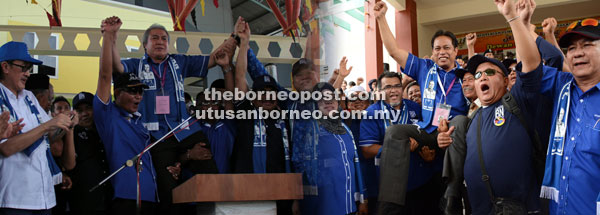 MENANG TANPA BERTANDING: Para penyokong menjulang Awang Tengah dan Dr Abdul Rahman yang masing-masing memenangi kerusi Bukit Sari dan Bukit Kota tanpa bertanding, semalam.