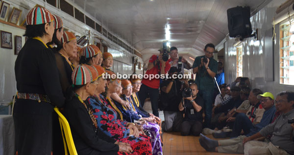 Ahmad Shabery and other visitors being entertained to traditional Kelabit singing during a visit at the Bario Asal longhouse.