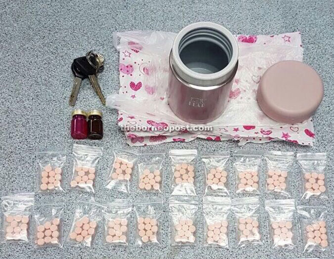 The Ecstasy pills and vials of liquefied  drugs seized from the suspect. 