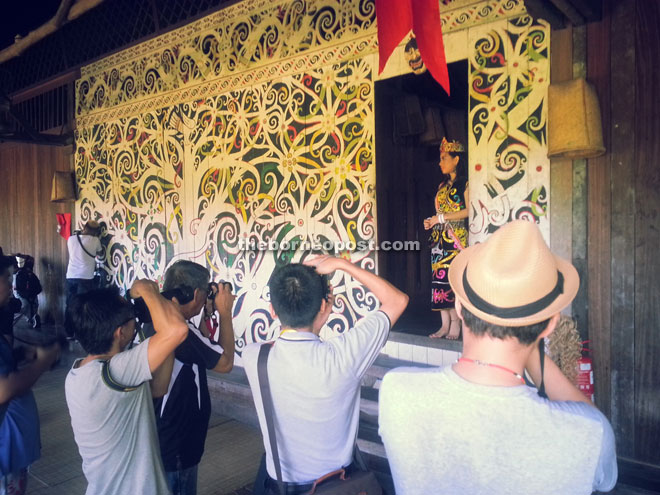 Photographers zoom in on one of the finalists of Miss Cultural Harvest Festival 2016.